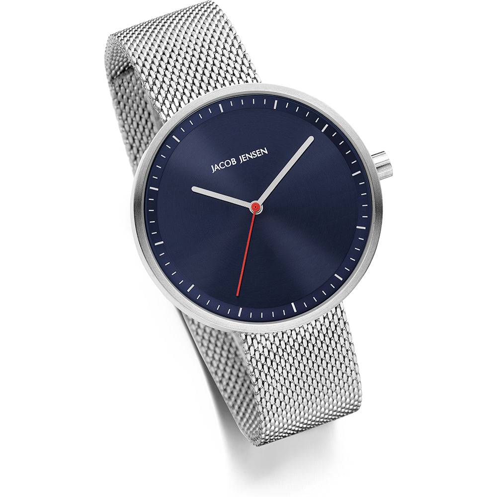 Jacob Jensen Strata JJ289 Strata dameshorloge 36mm met blauwe wijzerplaat en zilverkleurige mesh band, elegant en modern design.