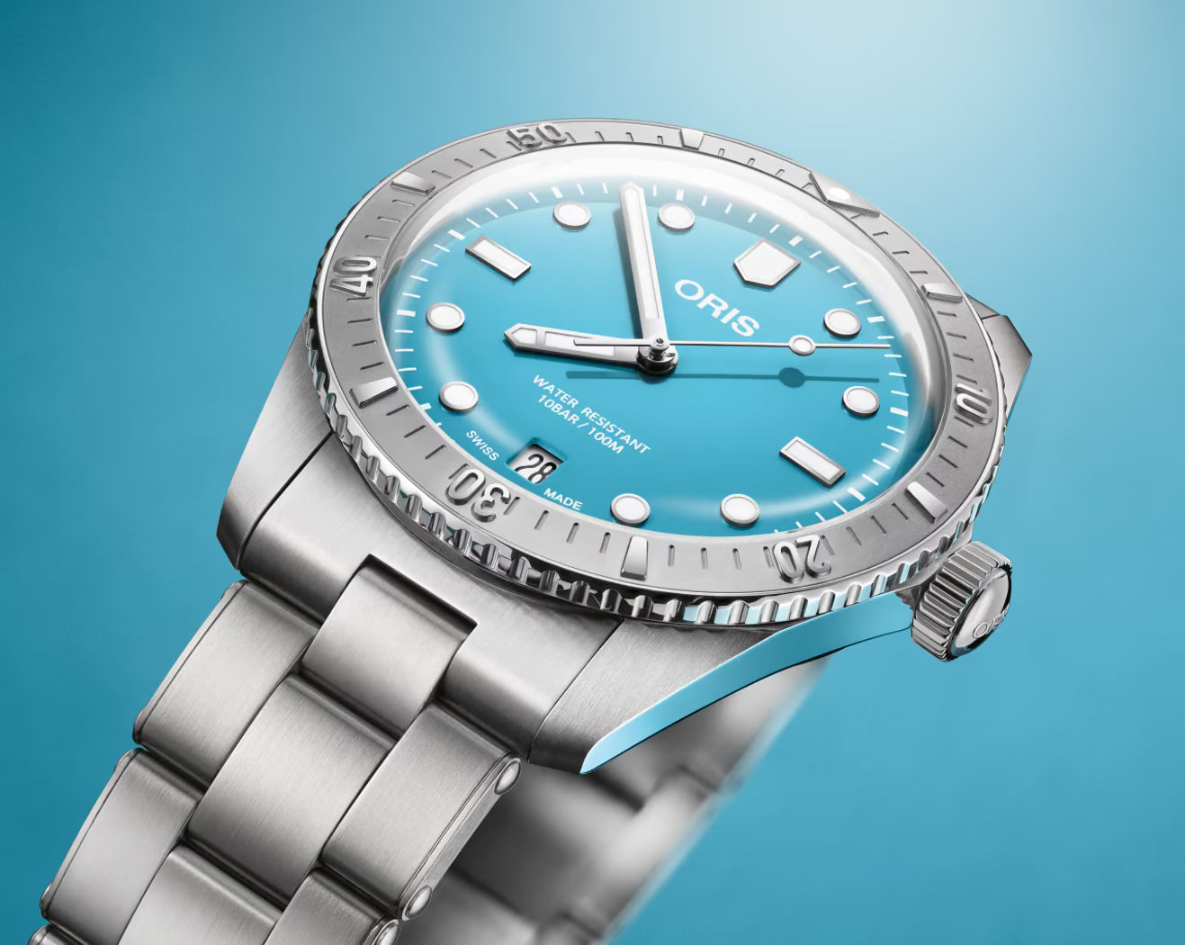 Oris Divers Sixty-Five Cotton Candy Unisex 01 733 7771 4055-07 8 19 18 horloge 38mm met turquoise wijzerplaat en roestvrijstalen band. Luxe Swiss Made heren horloge voor dames en heren.