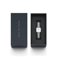 Daniel Wellington Quadro Studio DW00100521 31mm dameshorloge met zilveren mesh band in luxe zwarte geschenkverpakking. Elegant en minimalistisch design.