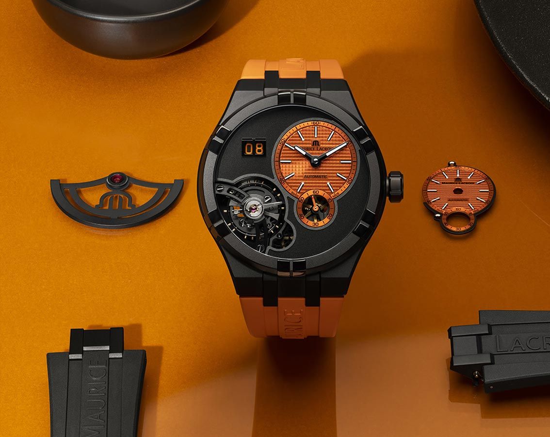 Maurice Lacroix Aikon Master Herenhorloge 45mm met oranje wijzerplaat en zwarte kast, luxe Swiss Made horloge voor heren in sportieve stijl.
